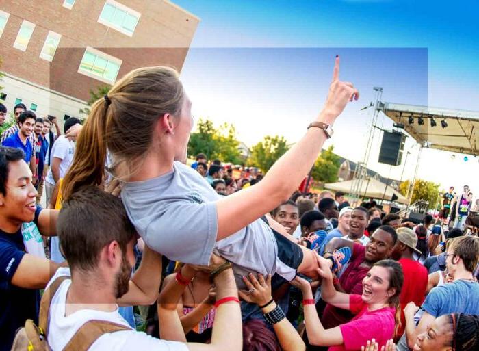 A girl people surfing at an event.